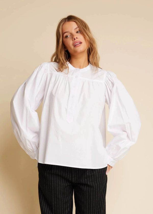 woman wearing white 100% cotton shirt Line of Oslo Lilly blouse