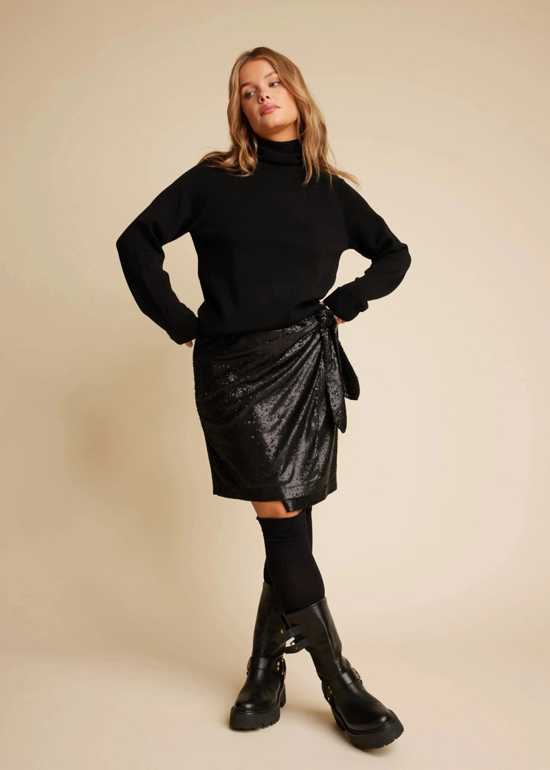 woman wearing wrap skirt Line of Oslo Maren Sequin skirt in black