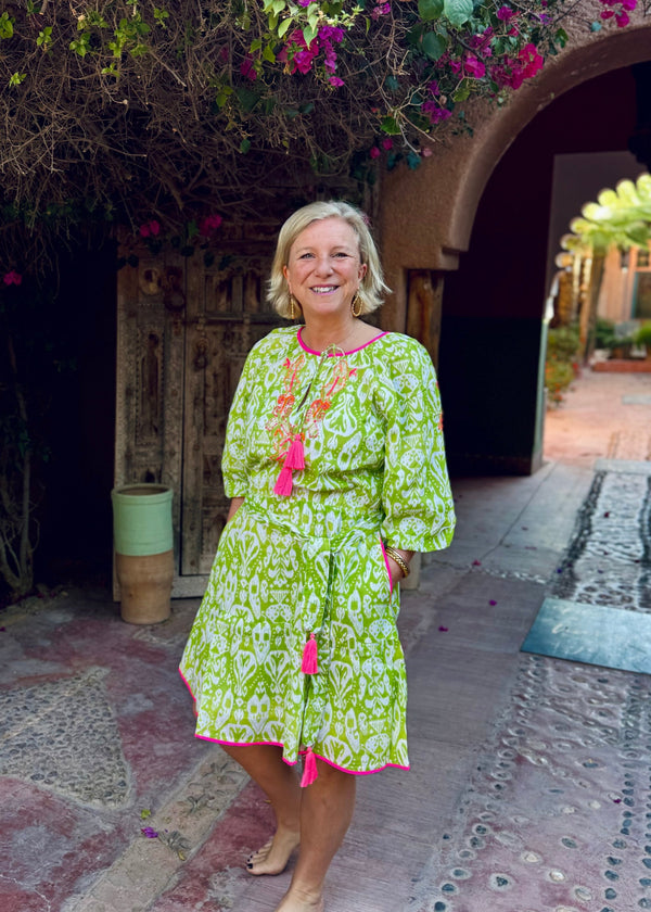 woman wearing Place du Soleil lime green dress