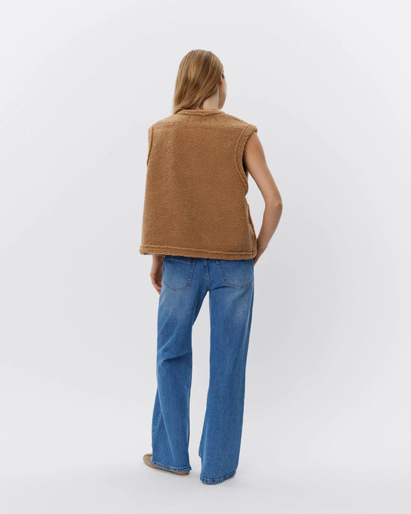 the back of Sofie Schnoor Teddy Bear Gilet faux fur fleece gilet